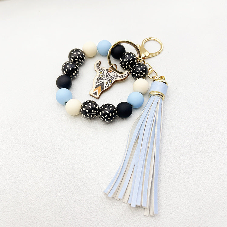 Wholesale Wooden Ox Head Sesame Spotted Wooden Beads PU Tassel Wrist Keychain